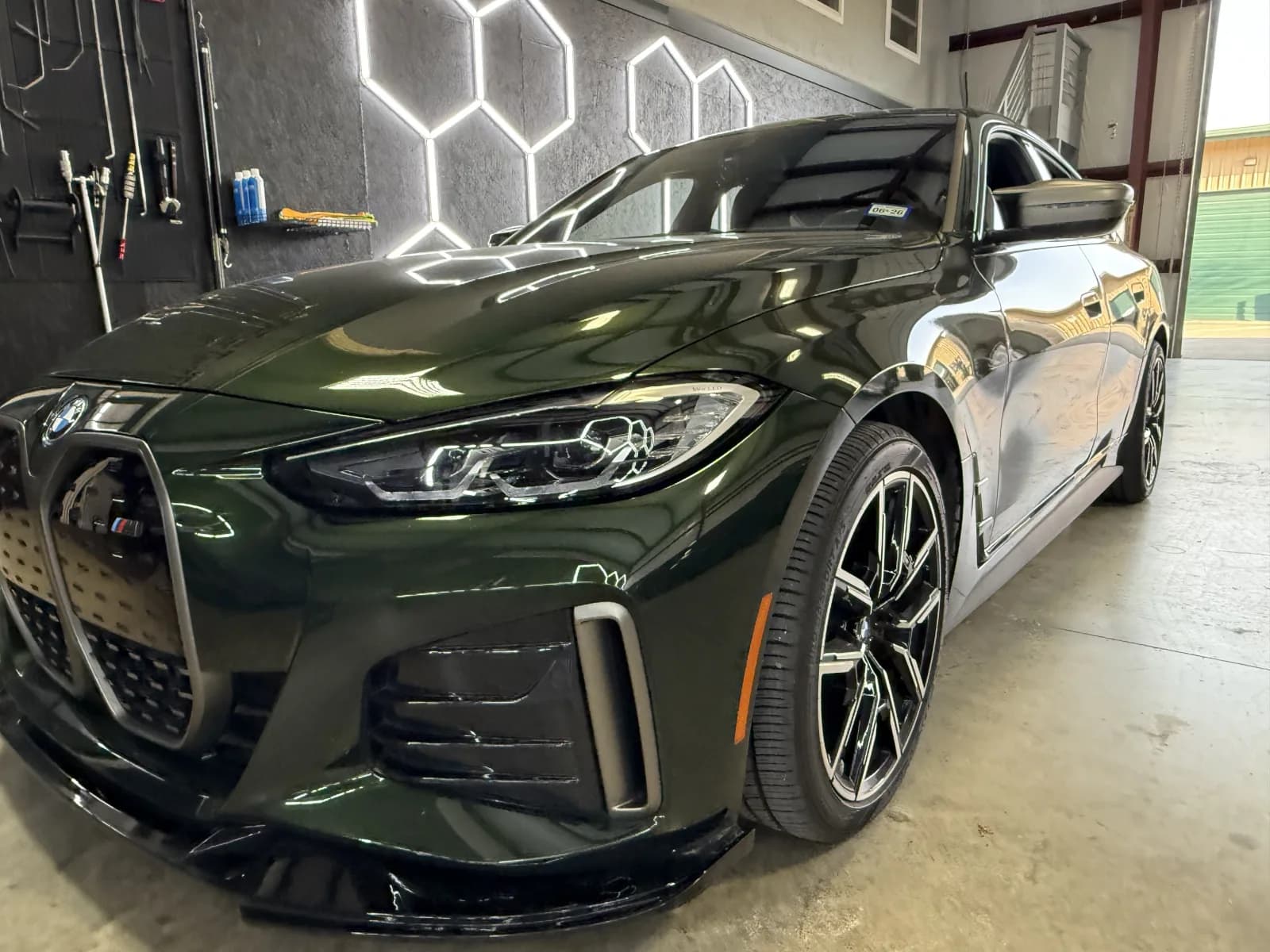 BMW in shop with hexagon lighting