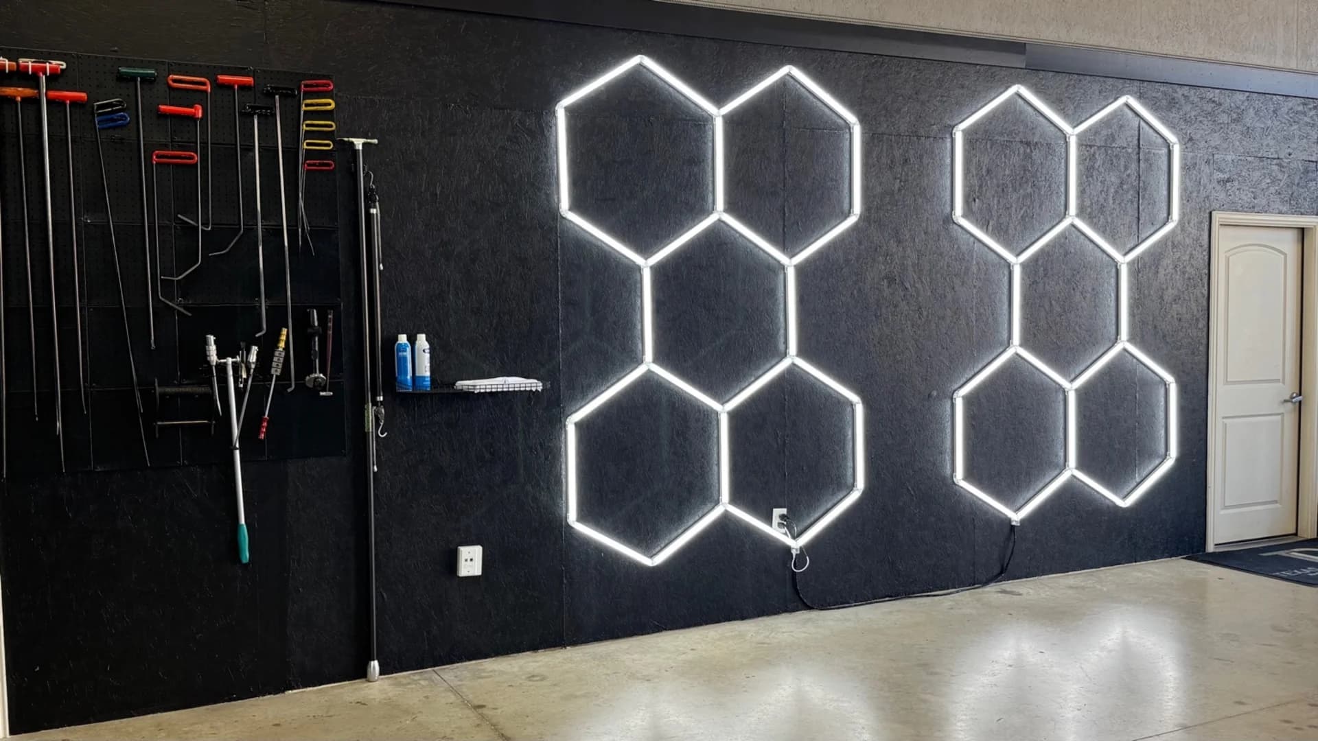 Texas Dent Company shop interior with hexagonal lighting and PDR tools