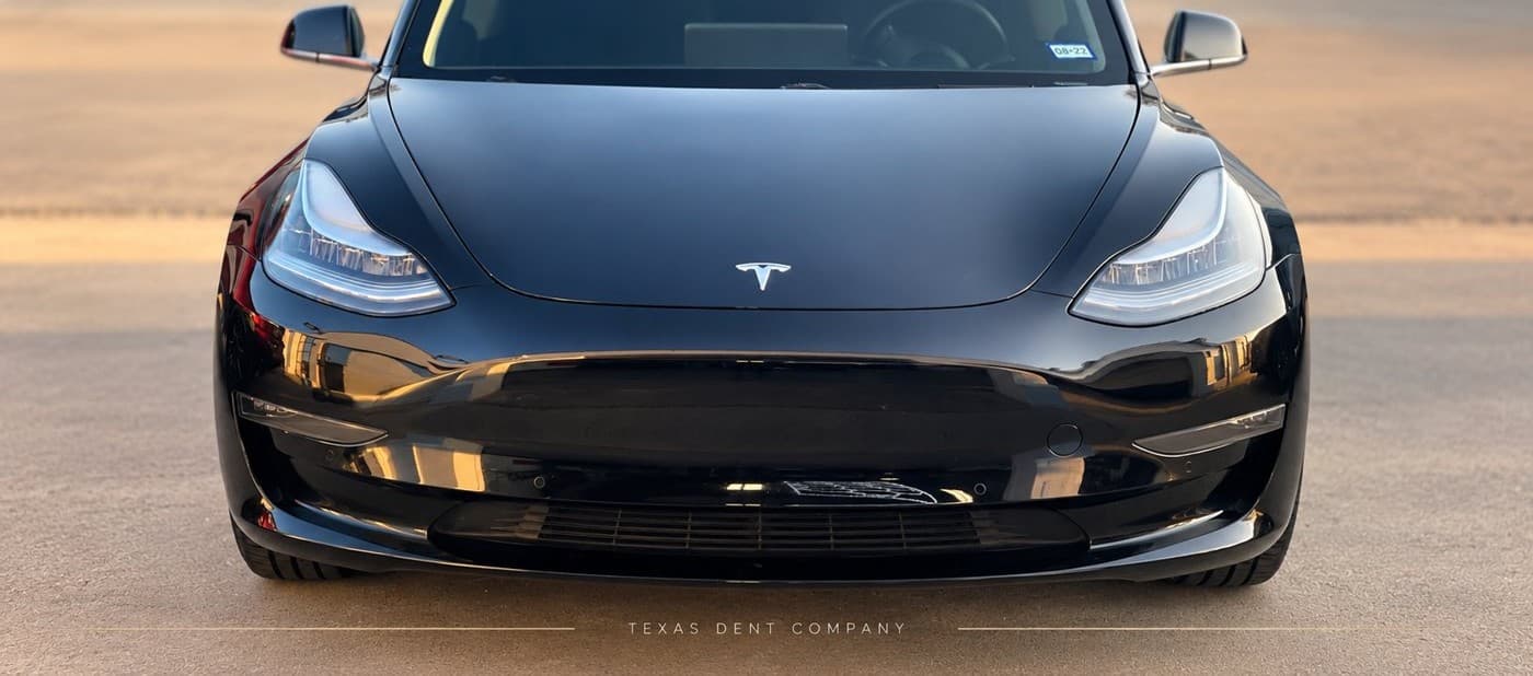 Black Tesla Model 3 front end at the Texas Dent Company Frisco facility